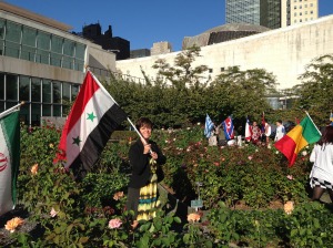 Flag-bearer for Syria at the UN International Day of peace, 2013. 